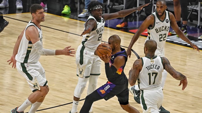 Jrue Holiday plays defense on Chris Paul in the NBA Finals